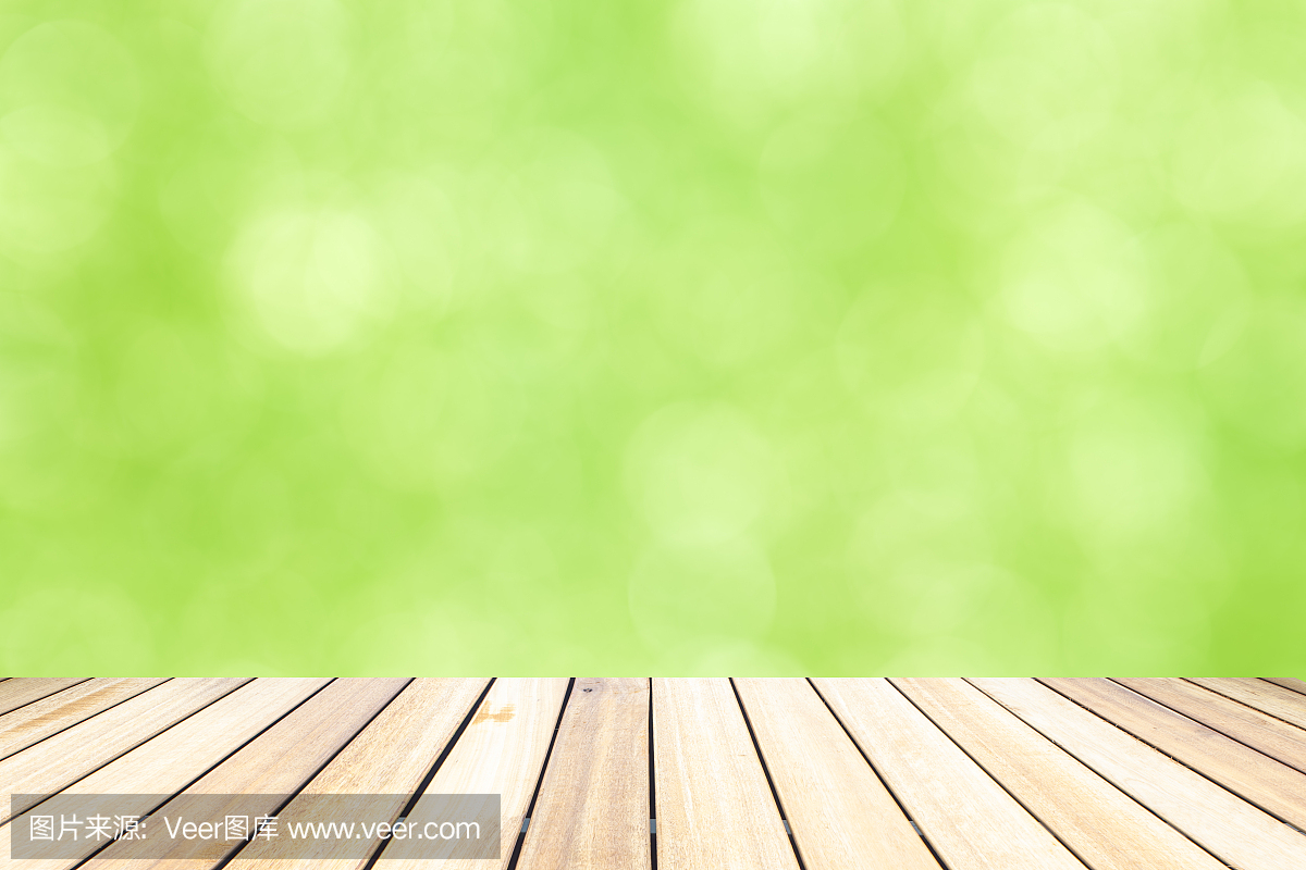 老木桌面在绿色散景抽象背景