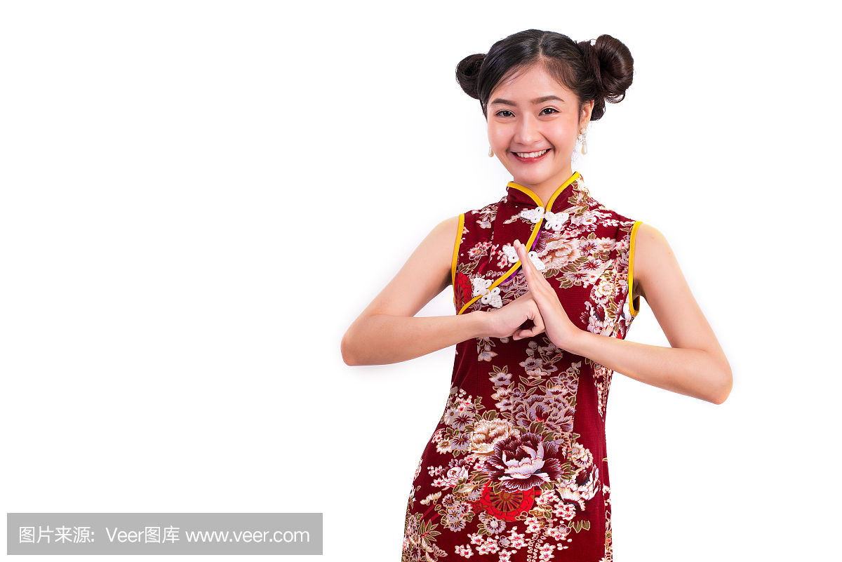 年轻的亚洲美女女人穿着旗袍和祝福或问候姿态