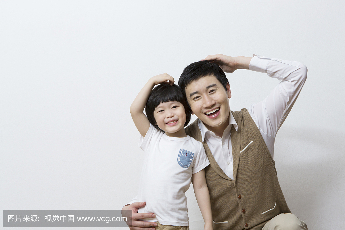 Smiling father and son