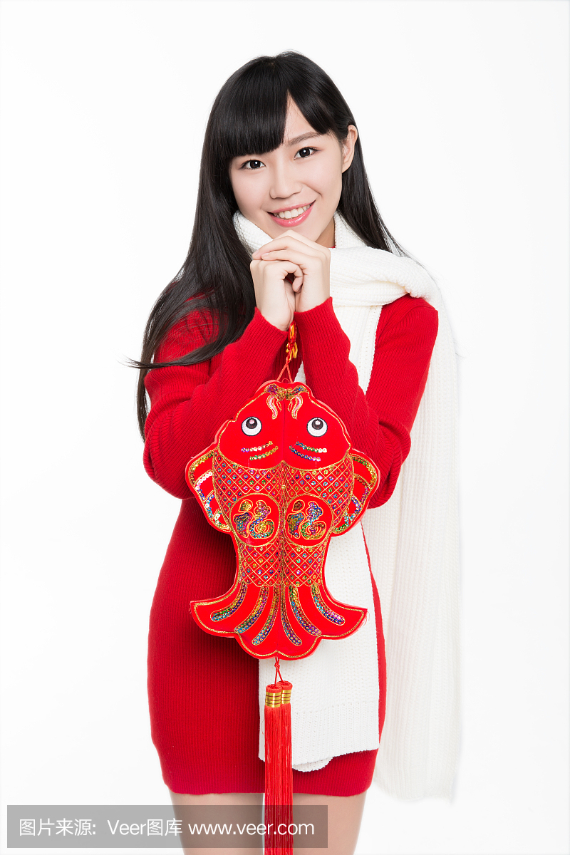 漂亮的女孩,抱着中国的新年装饰