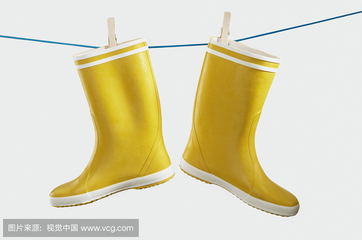 Yellow Galoshes Hanging on Clothesline