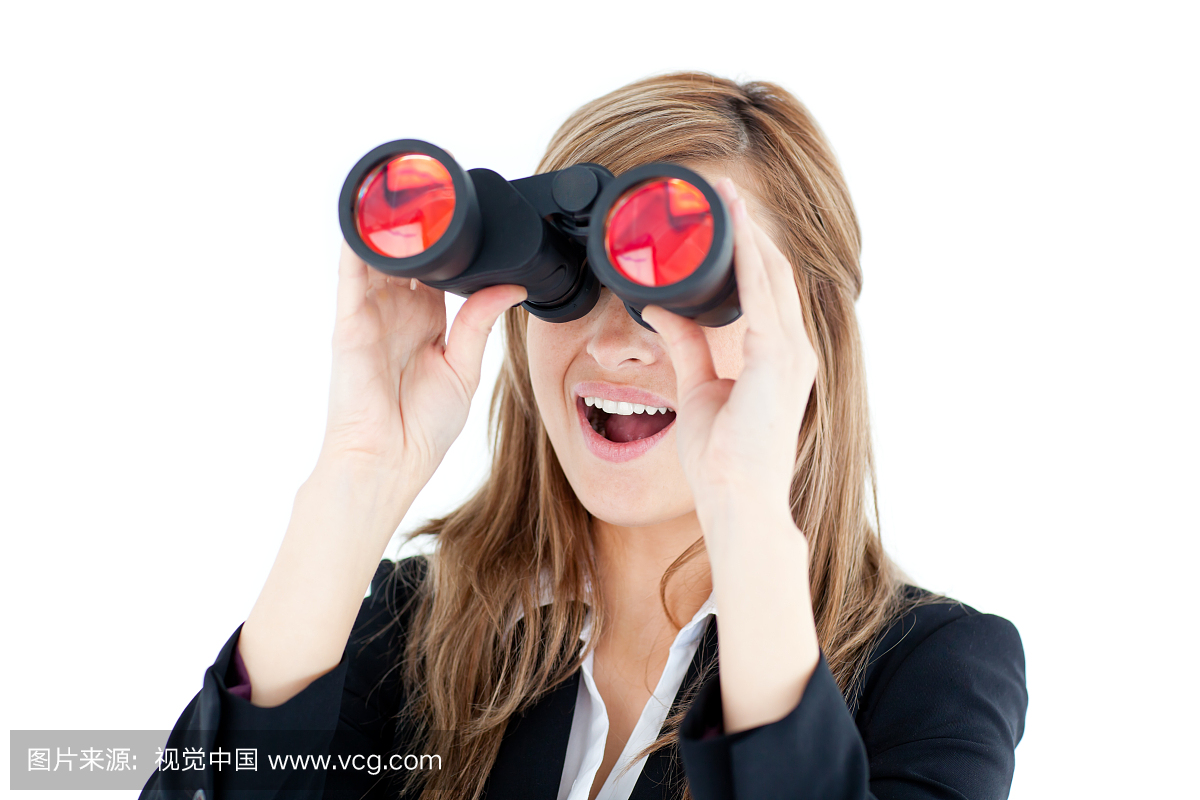 Fascinated young businesswoman looking thro